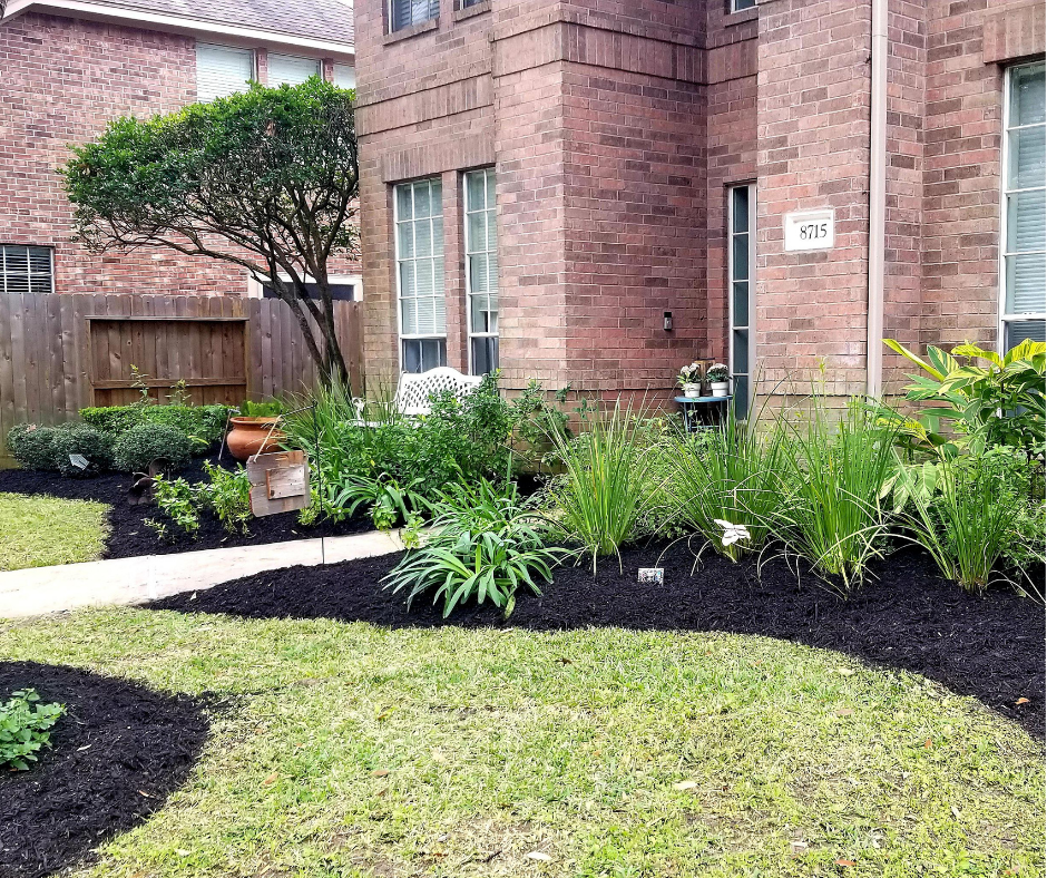 Mulching services in South Jordan & Salt Lake City by J&A Landscaping – adding mulch to garden beds for healthier plants.